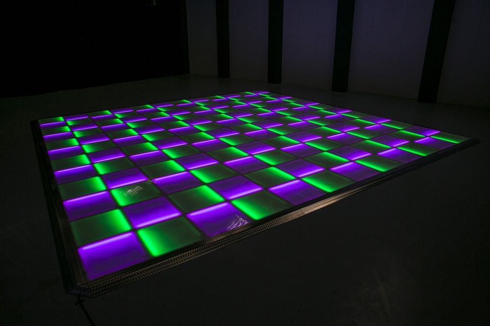LED dance floor panels lit green, purple and white