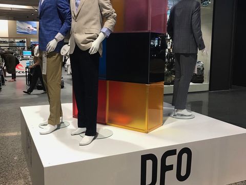 Product display stage with mannequins and a DFO sign, built for the DFO opening